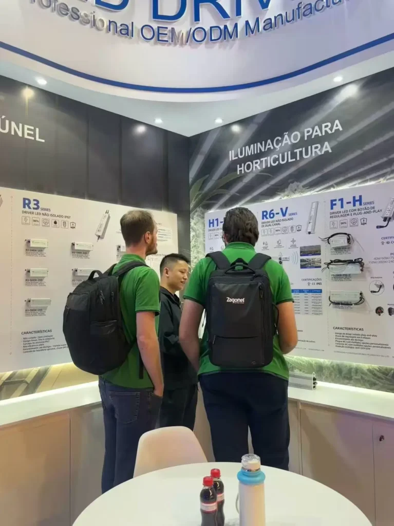 Face-to-face product discussion in the horticulture lighting display area.